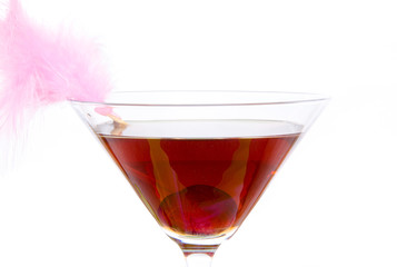 Cherry cocktail in a environment of sand and pebble stones