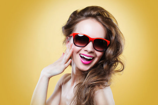 Attractive surprised  woman wearing sunglasses