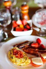 Breakfast with omelet, fresh fruits and coffee