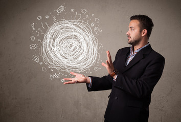 Chaos concept in the hand of a businessman