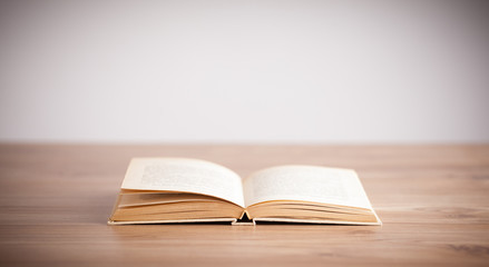 Open book on wooden deck