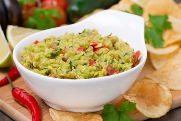snack - Mexican sauce guacamole and chips in a bowl