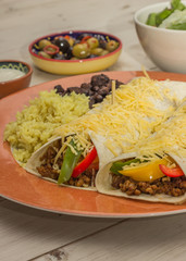 Burritos filled with ground beef and peppers