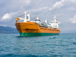 cargo ship moving boats