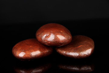 Colorful pebbles, isolated on black