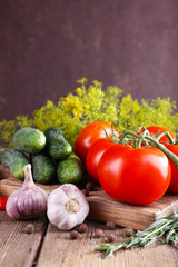 Fresh vegetables with herbs and spices on table, close-up