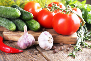 Fresh vegetables with herbs and spices on table, close-up