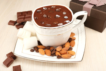 Cup of hot chocolate on table, close up