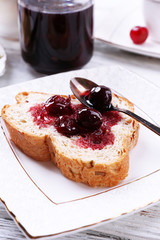 Fresh toast with  homemade butter on plate on wooden background