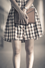 Portrait of smiling woman hold book