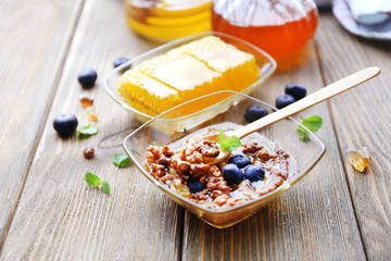 Fresh snack with honey on wooden table