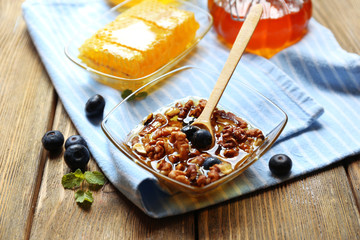 Fresh snack with honey on wooden table