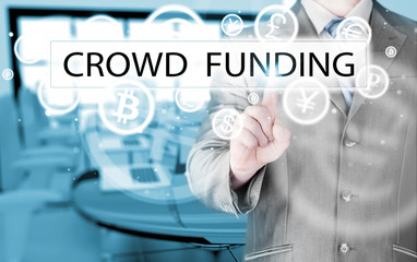 Businessman pushes virtual crowd funding button
