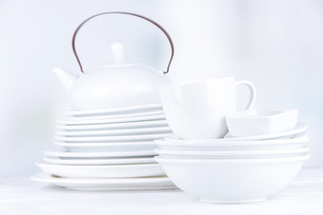 White crockery and kitchen utensils,