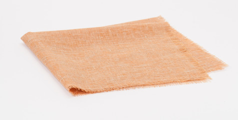 Fototapeta na wymiar Folded Natural Linen Napkin On White Background
