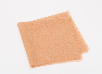 Folded Natural Linen Napkin On White Background