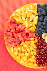 Sliced fruits on plate on table