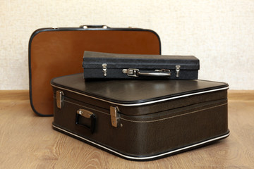 Vintage old travel suitcases on floor