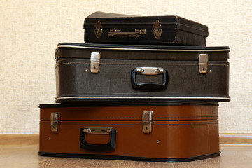 Vintage old travel suitcases on floor