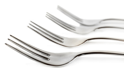 Metal small dessert forks isolated on white