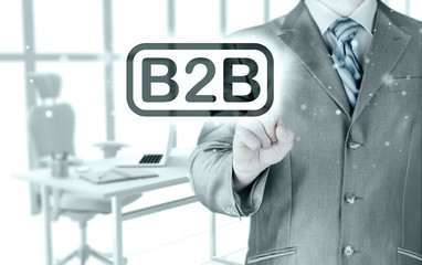 businessman pointing to word B2B