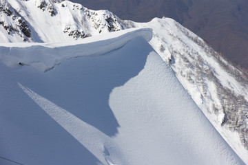 mountain slope and snow cornice