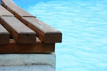 Fototapeta na wymiar Wooden deck on the pool