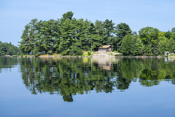 Fototapeta na wymiar Cottage on a Tranquil Lake