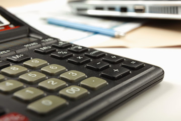Obraz premium Calculator, pen, folder with documents