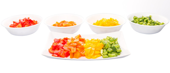 Colorful chopped capsicums in a plate and bowls