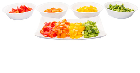 Colorful chopped capsicums in a plate and bowls