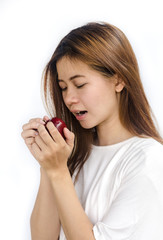 young woman eating an apple.