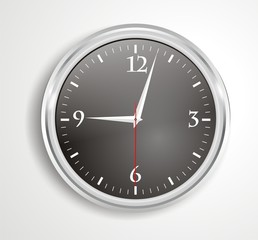 A big black wall clock