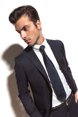 side view of a fashion businessman with hands in pockets