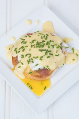 Eggs Benedict toasted English muffins ham poached eggs and holla