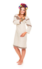 Young beautiful smiling girl in Ukrainian costume on the white