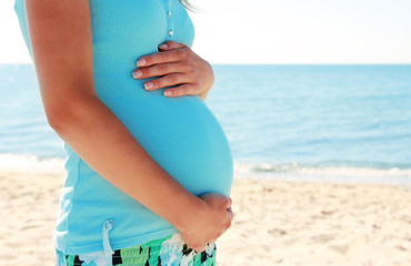 pregnant woman on the beach