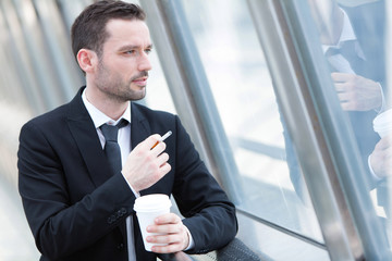 Portrait of an attractive businessman having a break