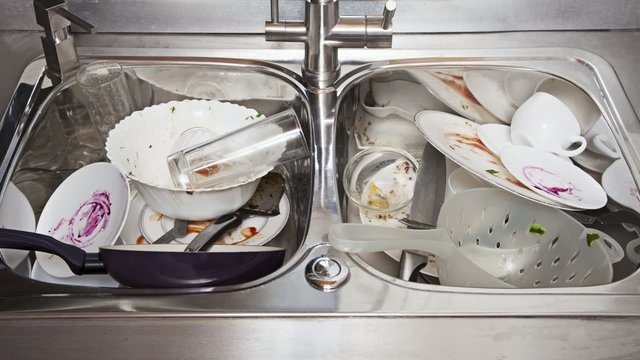 Time-lapse of dirty dishes stack moving