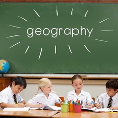 Geography against cute pupils sitting at desk