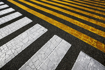 yellow and white lines on asphalt
