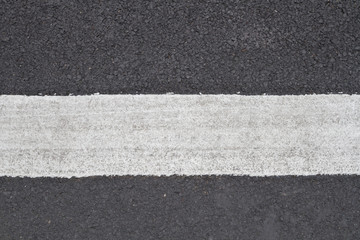 Asphalt road and traffic sign