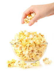Popcorn in glass bowl isolated on white