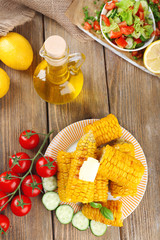 Grilled corn cobs on table, close-up