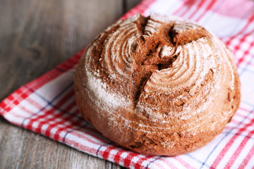 Fresh baked bread, on wooden background
