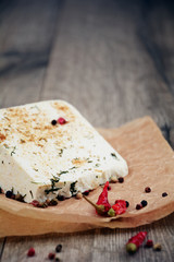 Tasty old peace of cheese on the table