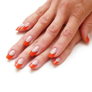 Manicure on short nails covered with red lacquered isolated