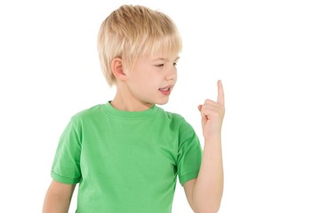 Cute little boy pointing up