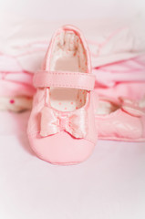 Little pink baby shoes and baby clothes