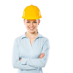 Portrait of smiling woman engineer wearing yellow helmet